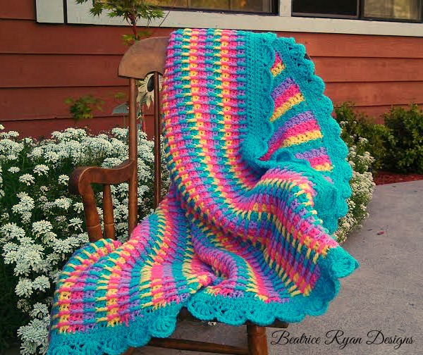 This Free Crochet Pattern is an adorable baby blanket that is bright 